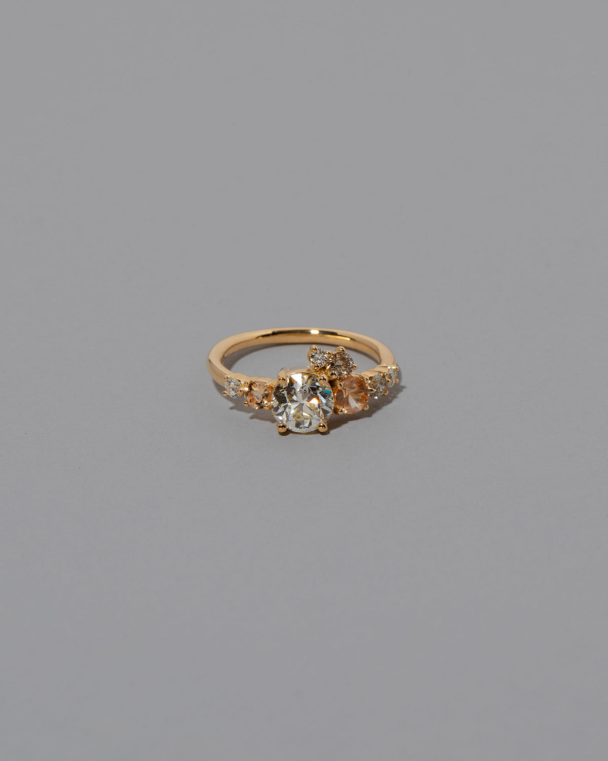 Peach Sapphire & Diamonds Luna Ring on light color background.
