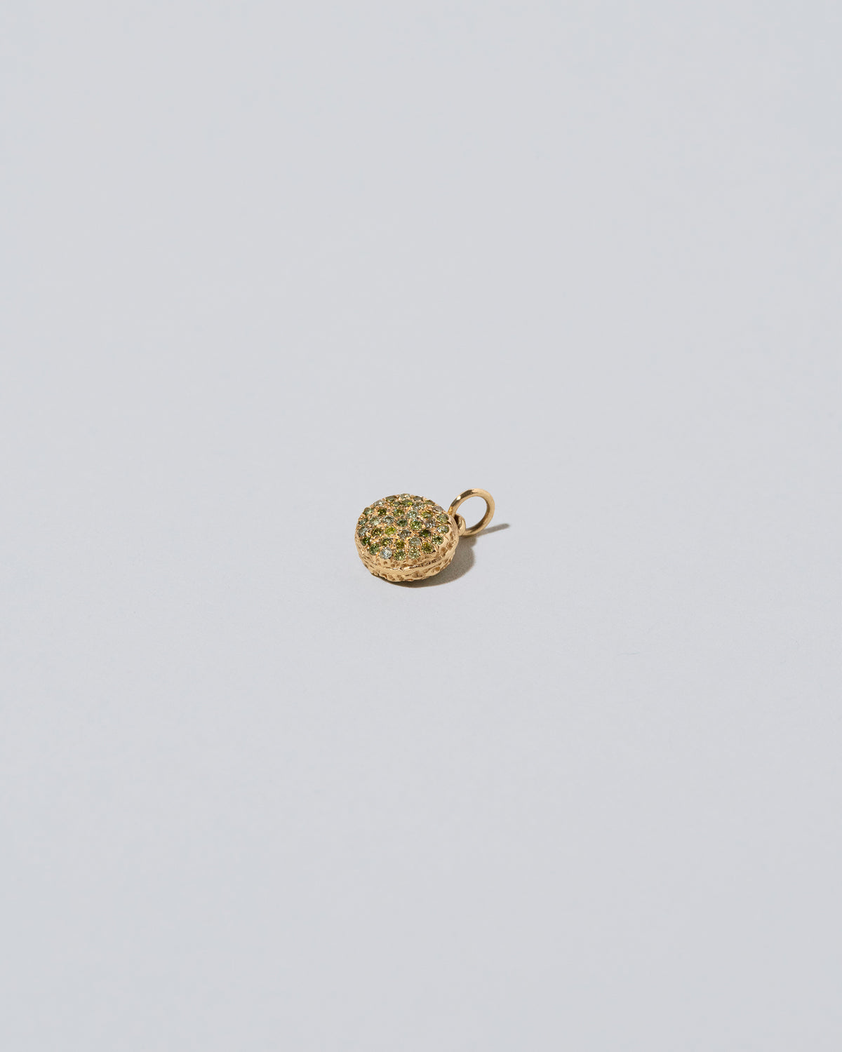 Mini Macaron Charm - Diamond Pavé Pistachio on light color background.