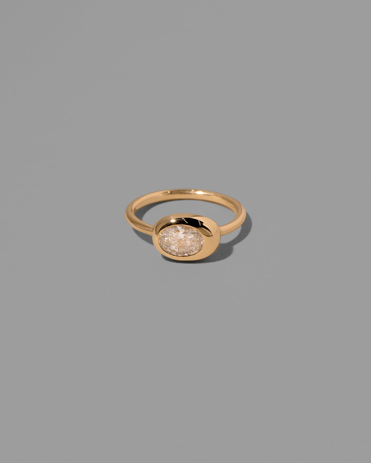 Oval Diamond Equalize Ring on light color background.
