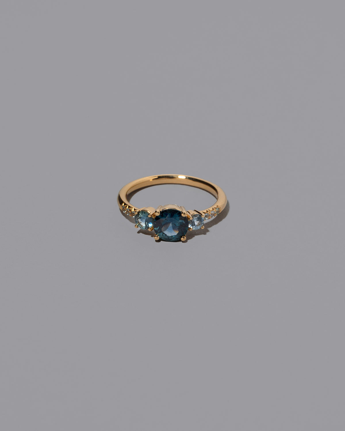 Sapphire Orion Ring on grey color background.