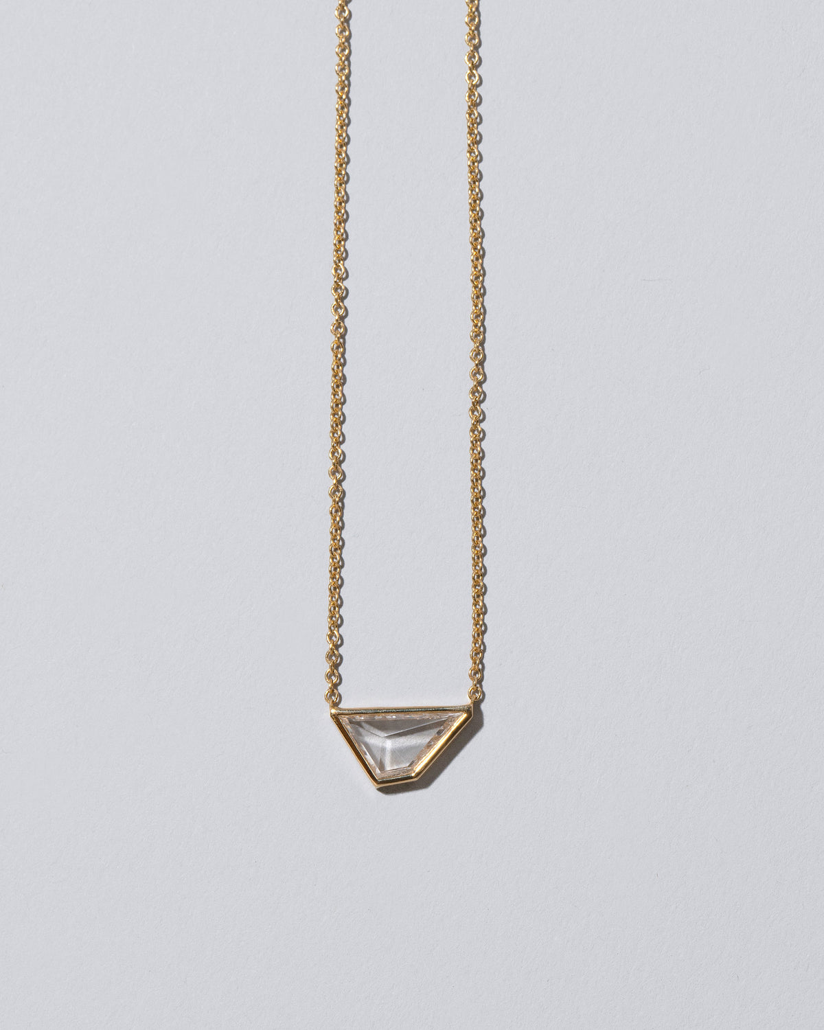 Closeup details of the Amplify Necklace on light color background.