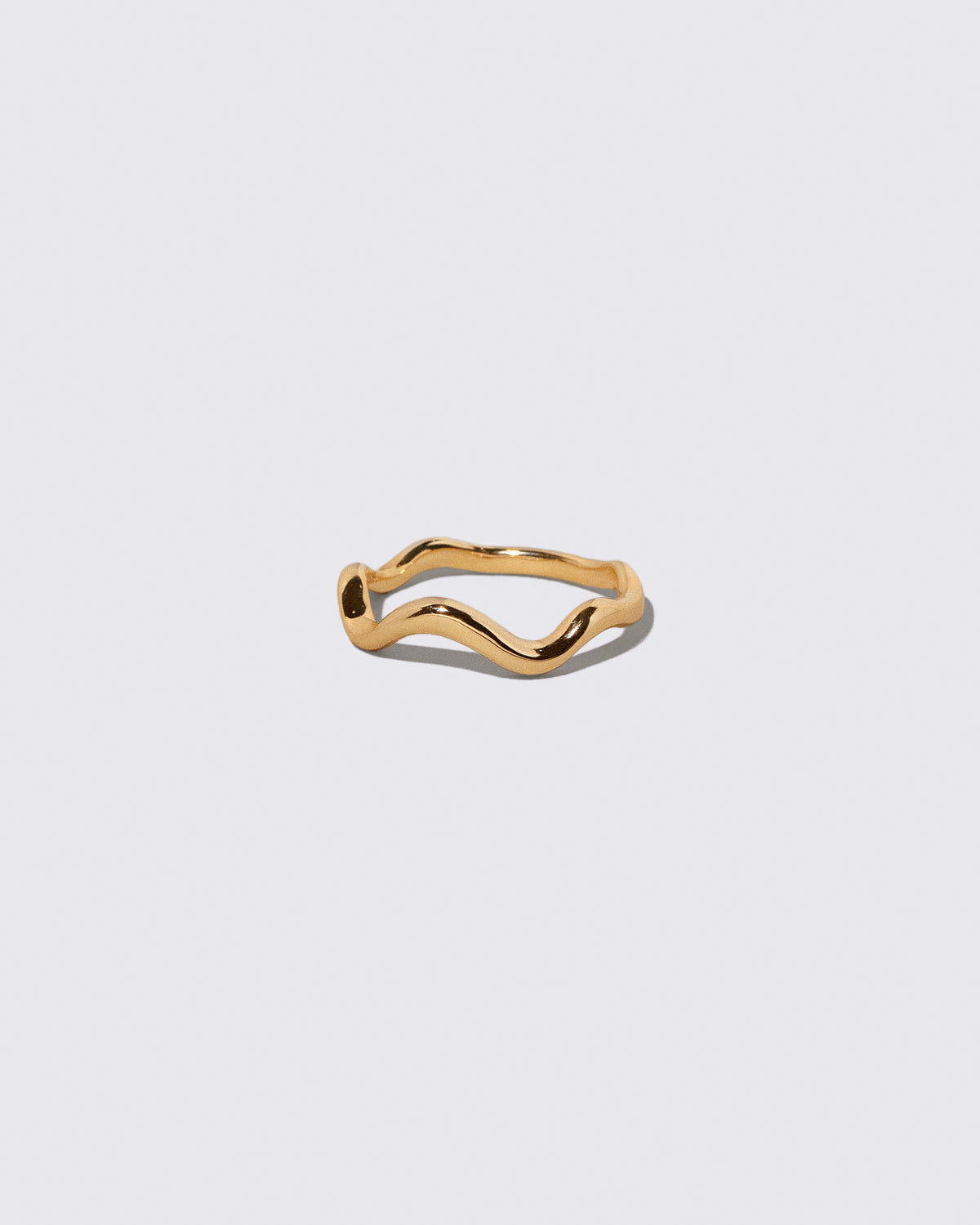Gold Bump Band on light color background.
