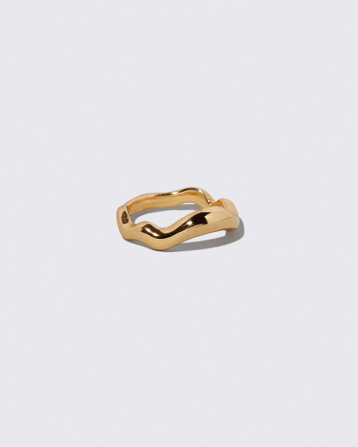View from the side of the Gold Equalize Band on light color background.