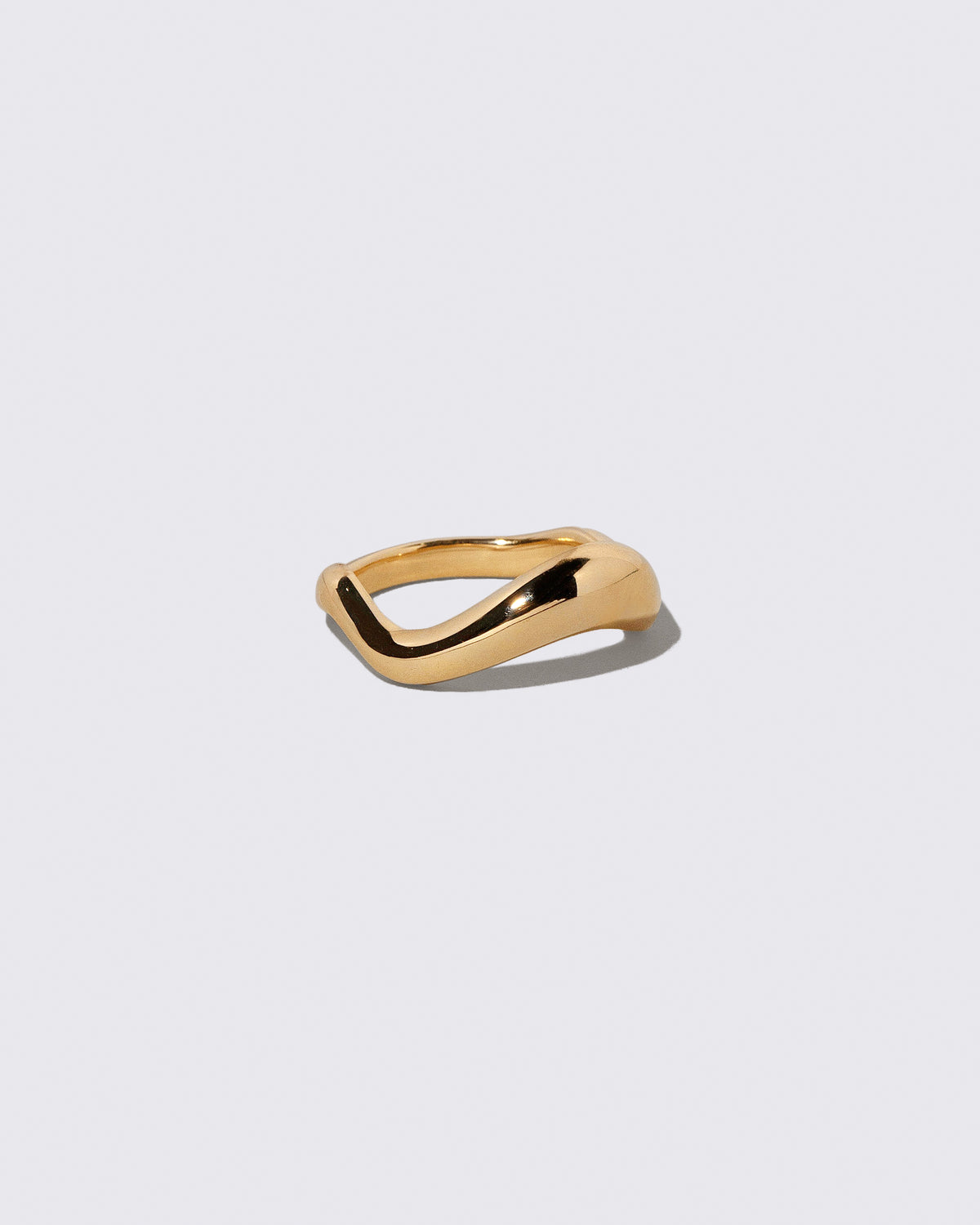 View from the side of the Gold Equate Band on light color background.