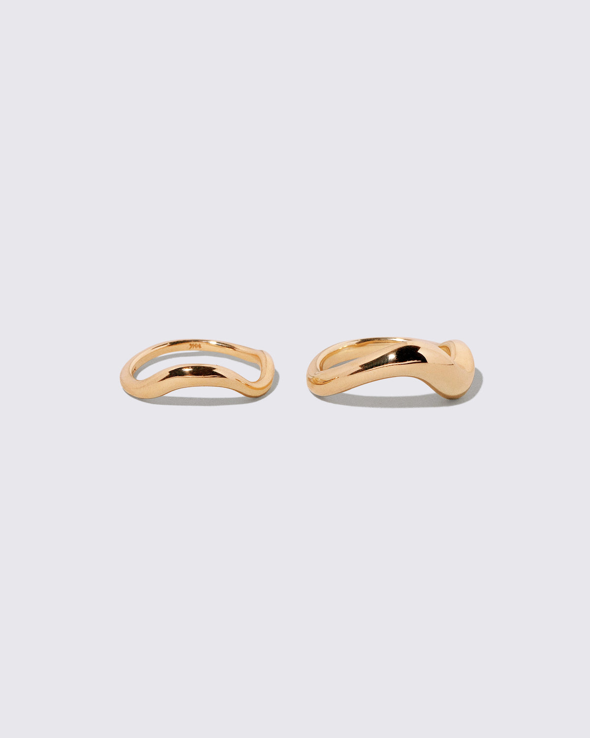 Gold Precise Band and Gold Unbroken Band on light color background.