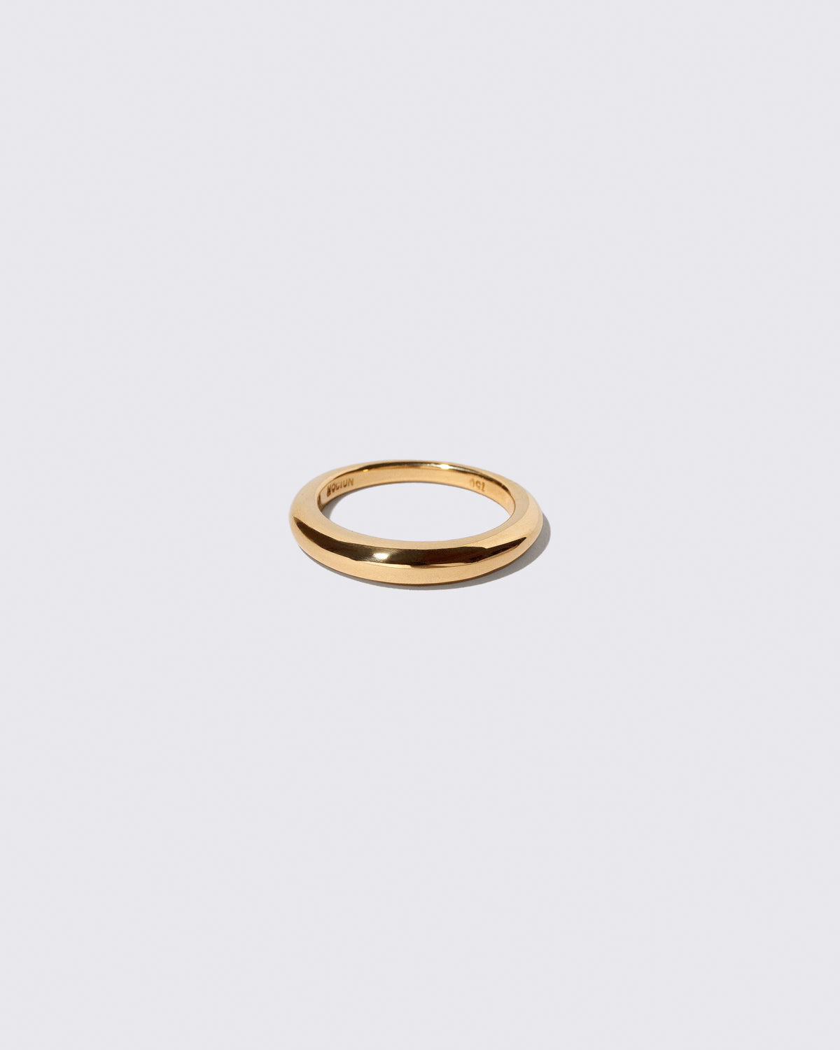 Gold 3.5mm Venus Band on light color background.