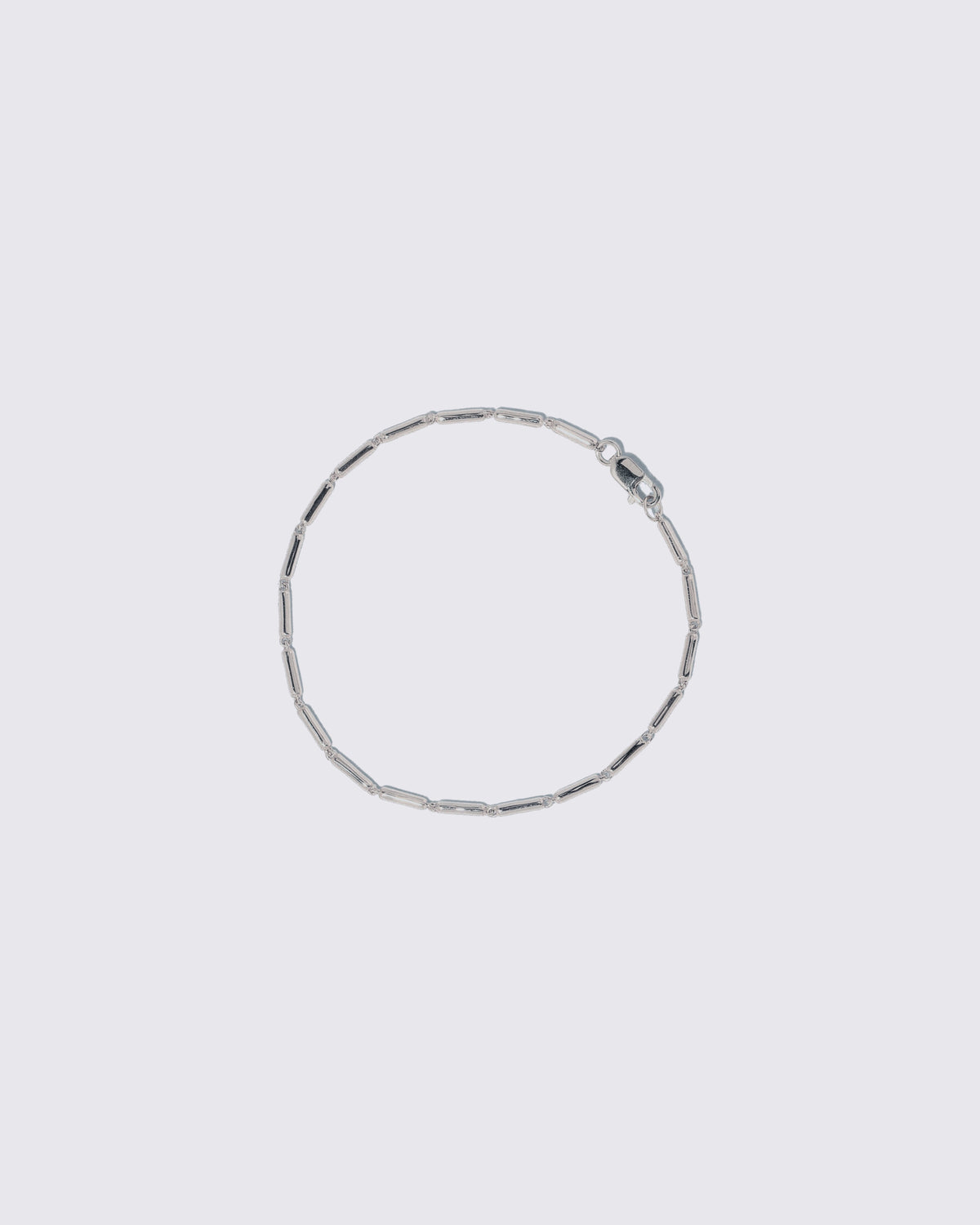 Platinum Butter Chain Bracelet on light color background.