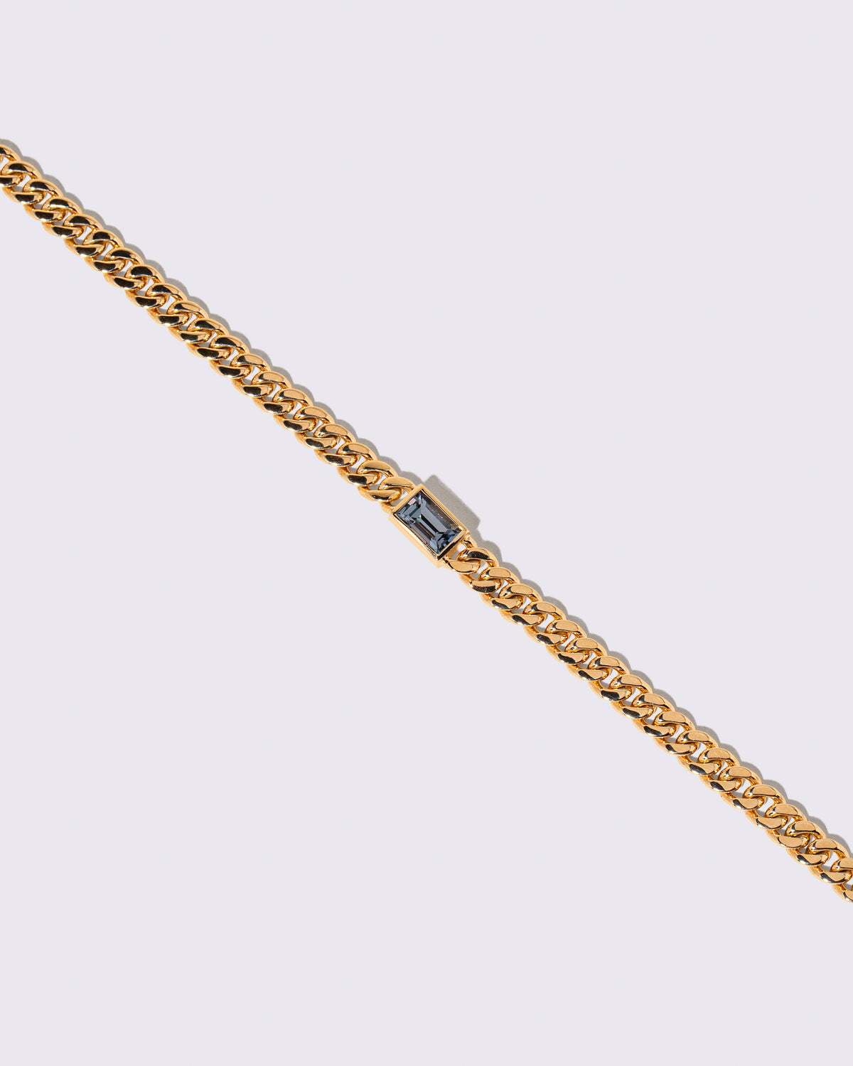 Closeup details of the Identity Chain Gray Spinel Bracelet 001 on light color background.