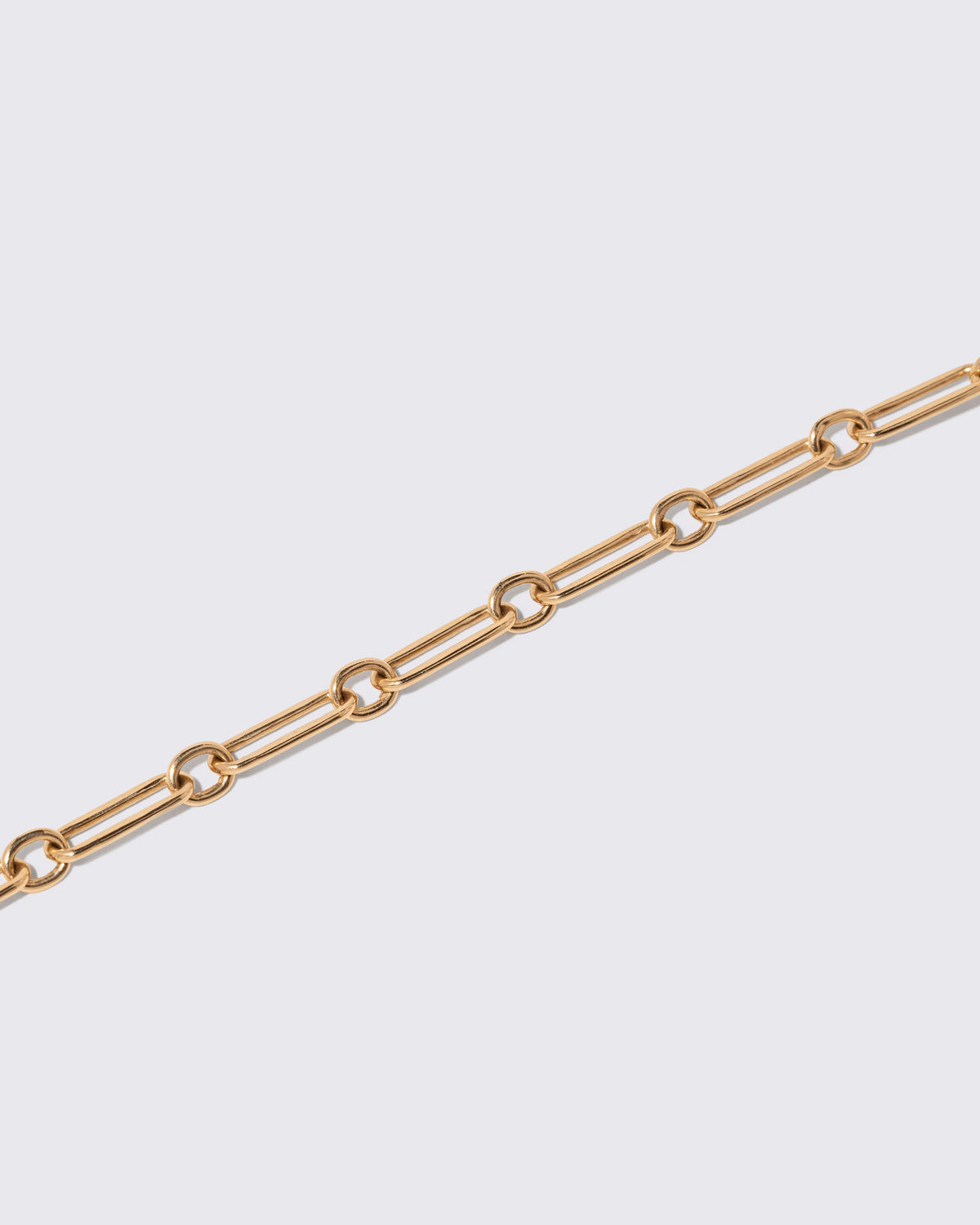 Petite Link Bracelet on light color background.