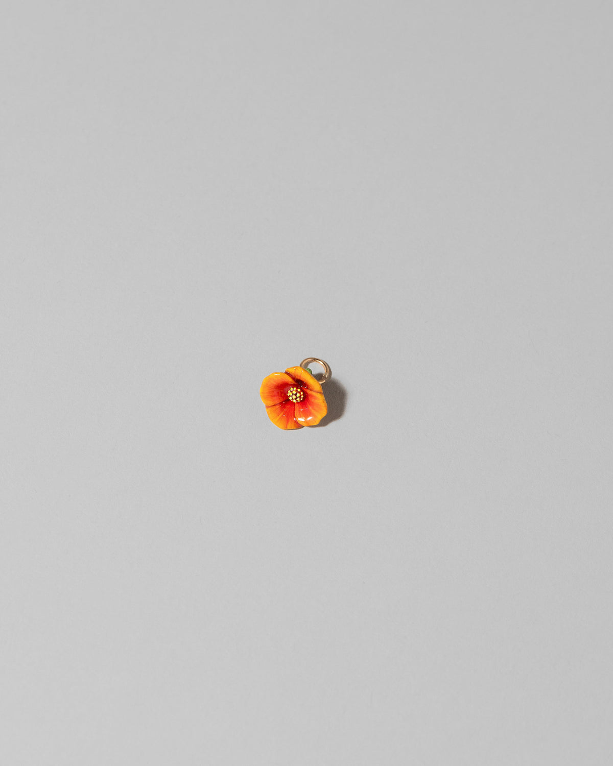 California Poppy Charm on light color background.