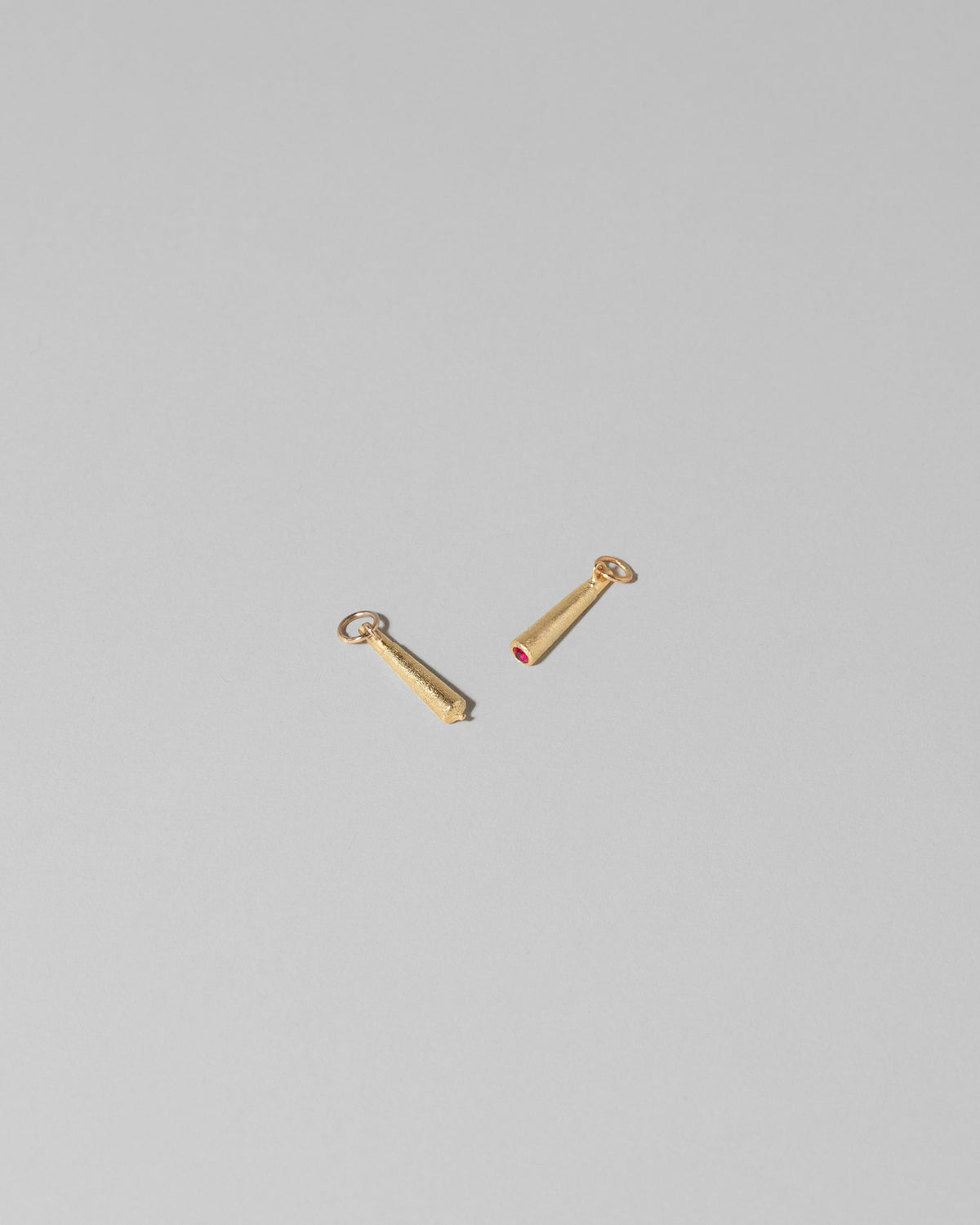 Joint Charm and Lit Joint Charm on light color background.