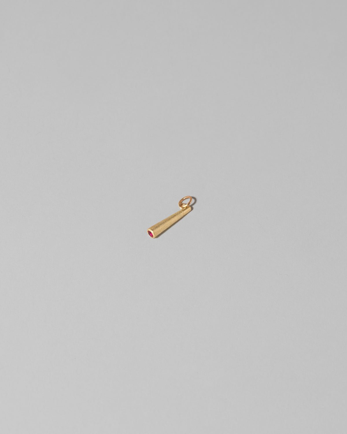 Lit Joint Charm on light color background.