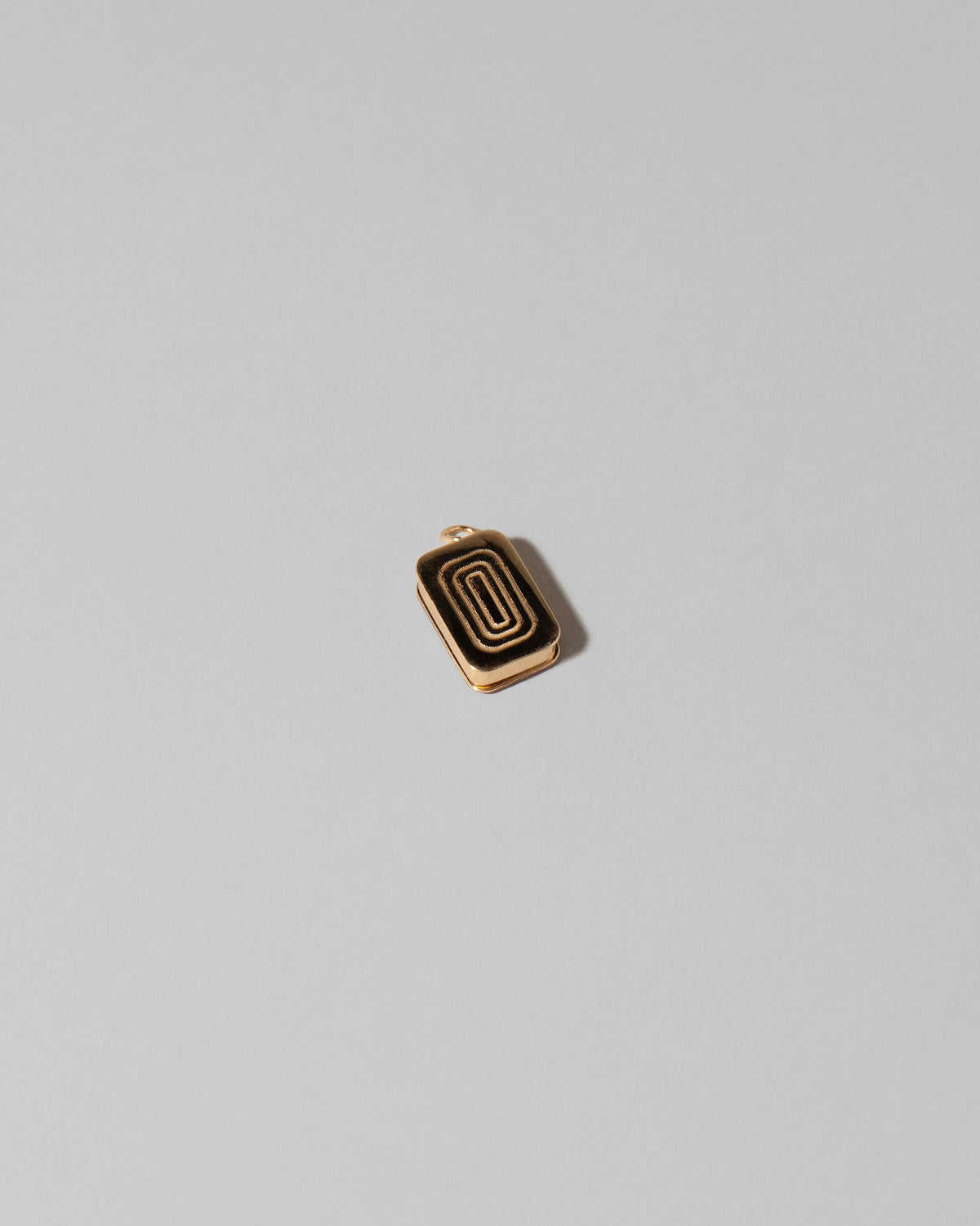 View from the back of the Sardine Can Charm on light color background.