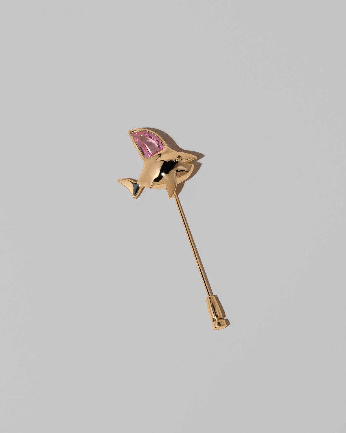 Simon Shark Pin on light color background.