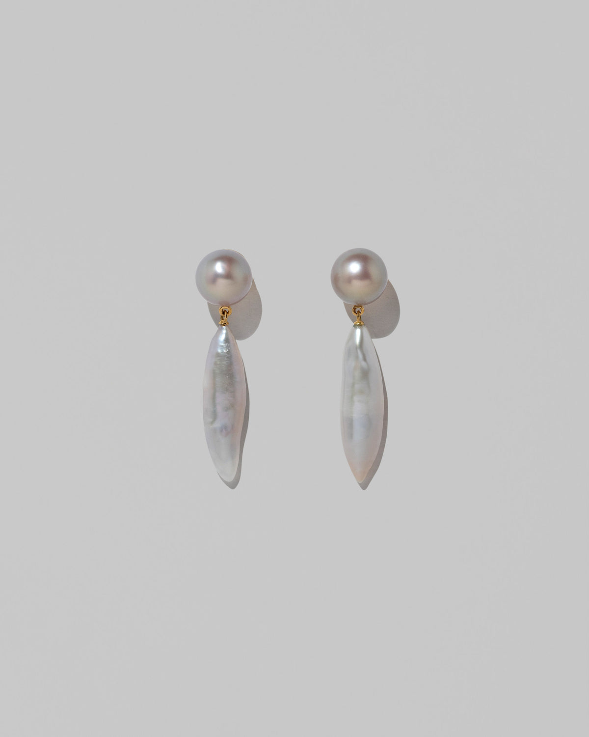 Aphrodite Earrings on light color background.