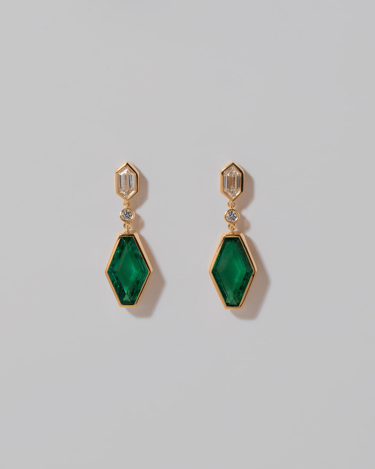 Trillium Earrings on light color background.