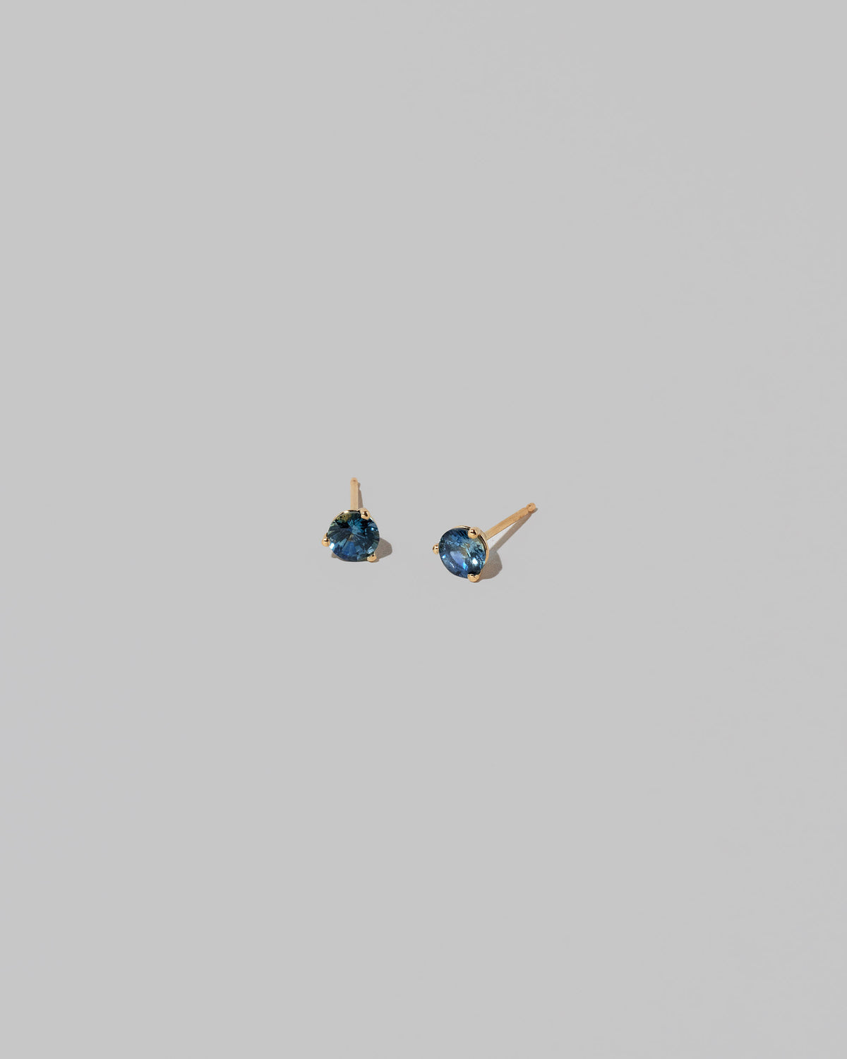 Grand Bicolor Yellow/Blue Sapphire Martini Stud Earrings on light color background.