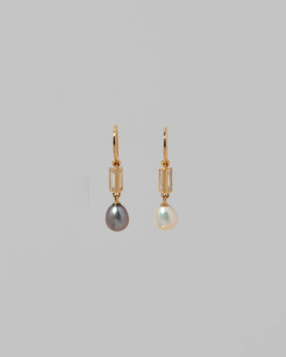 Poseidon Earrings on light color background.