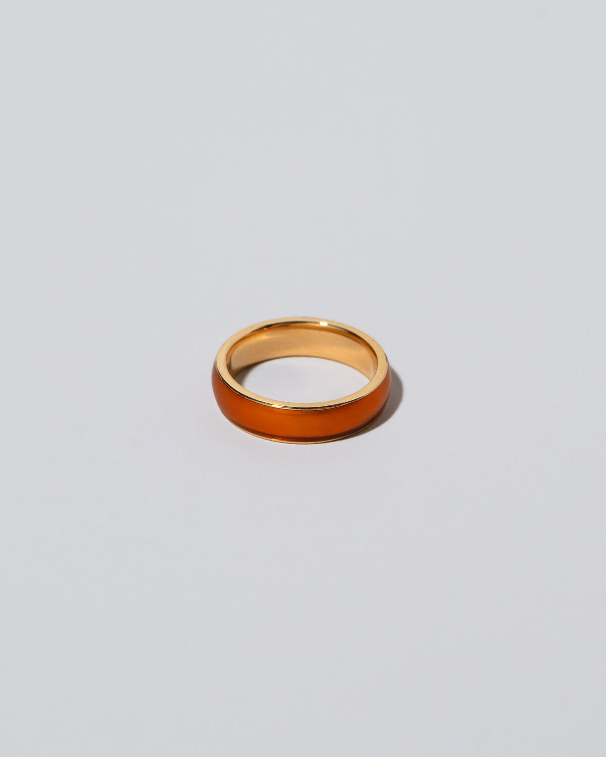 Enamel Band in Sunkist on light color background.