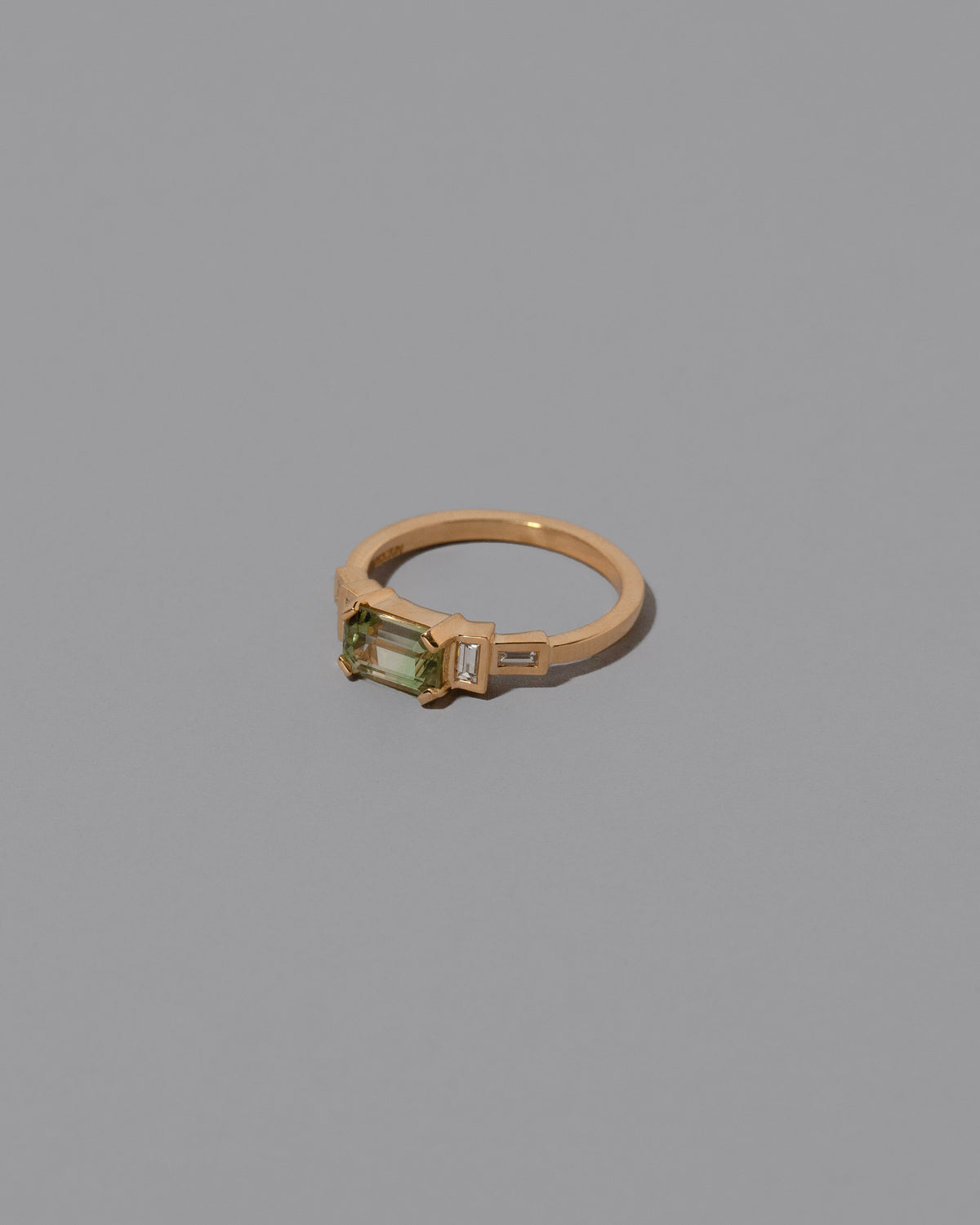 View from the side Bicolor Garnet Expression Ring on light color background.
