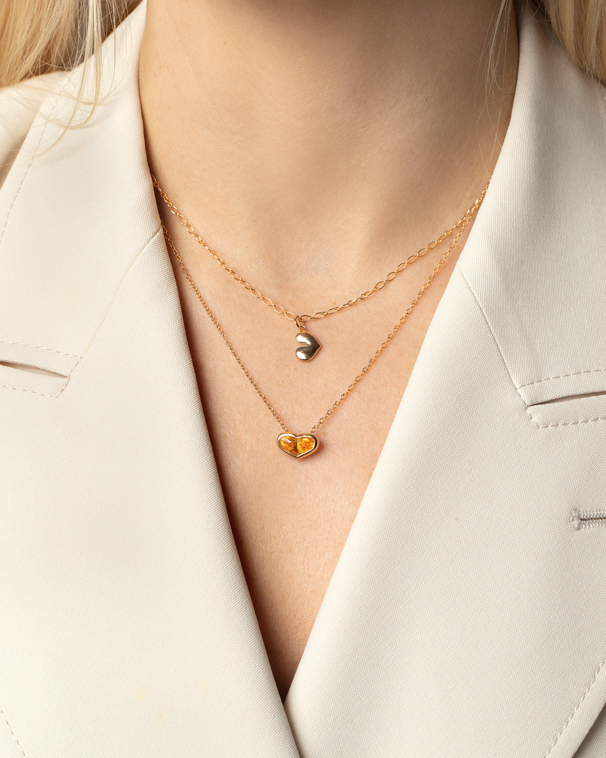 Styled image of model wearing the Venus Heart Pendant.