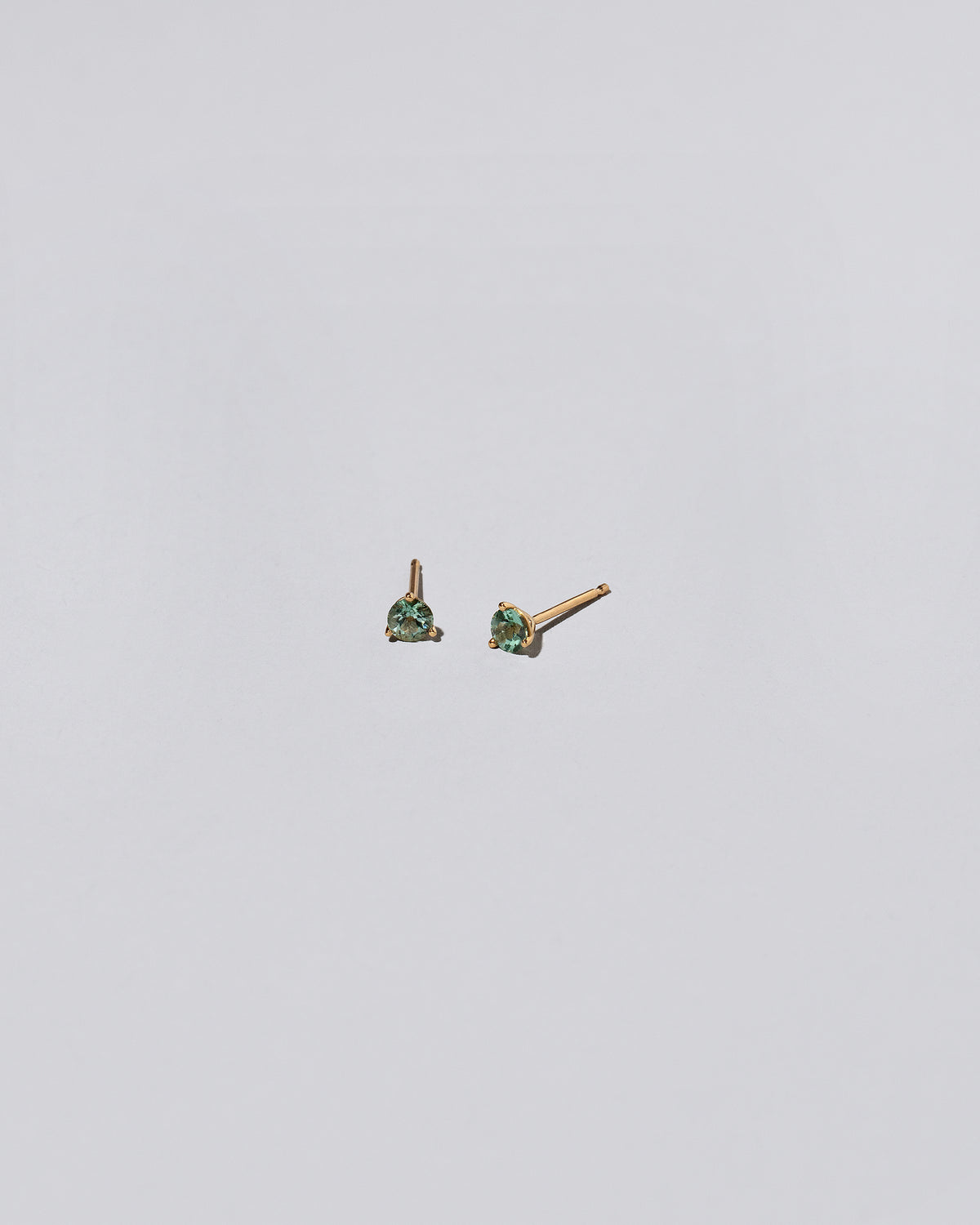 Tourmaline Stud Earrings on light color background.