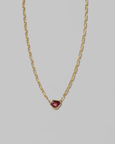 Closeup details of the Pink Sapphire Gusher Necklace on light color background.