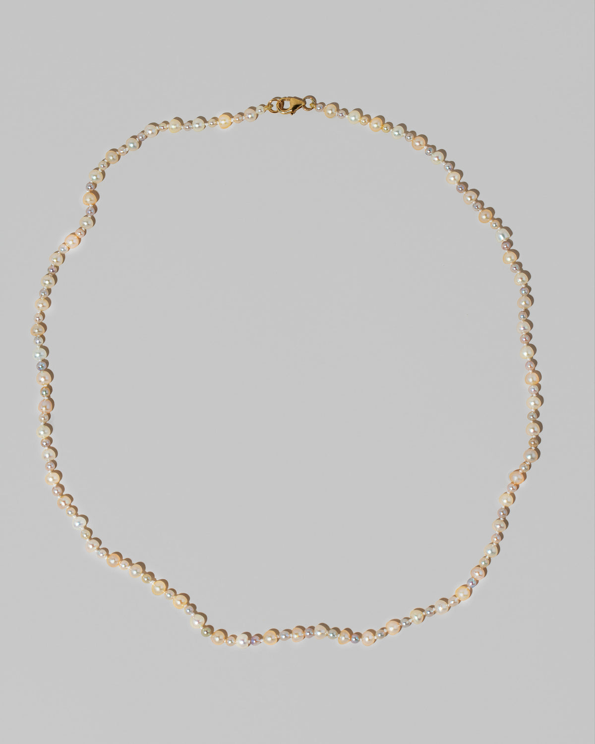 Ula Pearl Necklace 004 on light color background.
