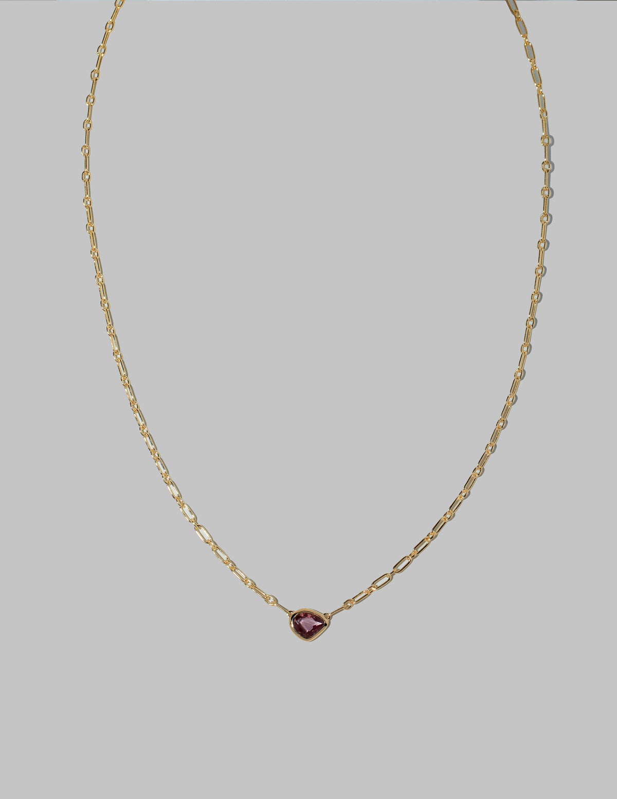 Pink Sapphire Gusher Necklace on light color background.