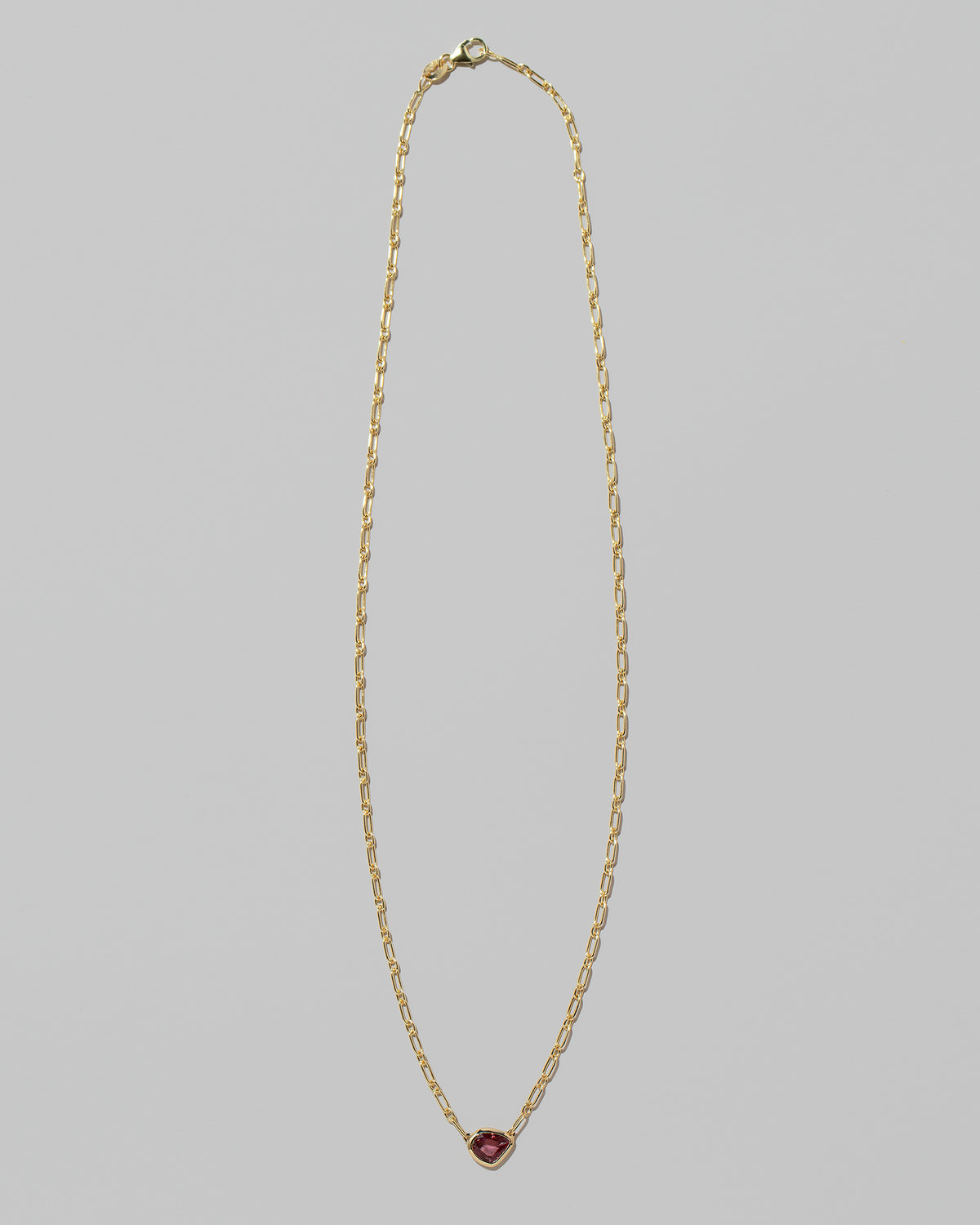 Pink Sapphire Gusher Necklace on light color background.