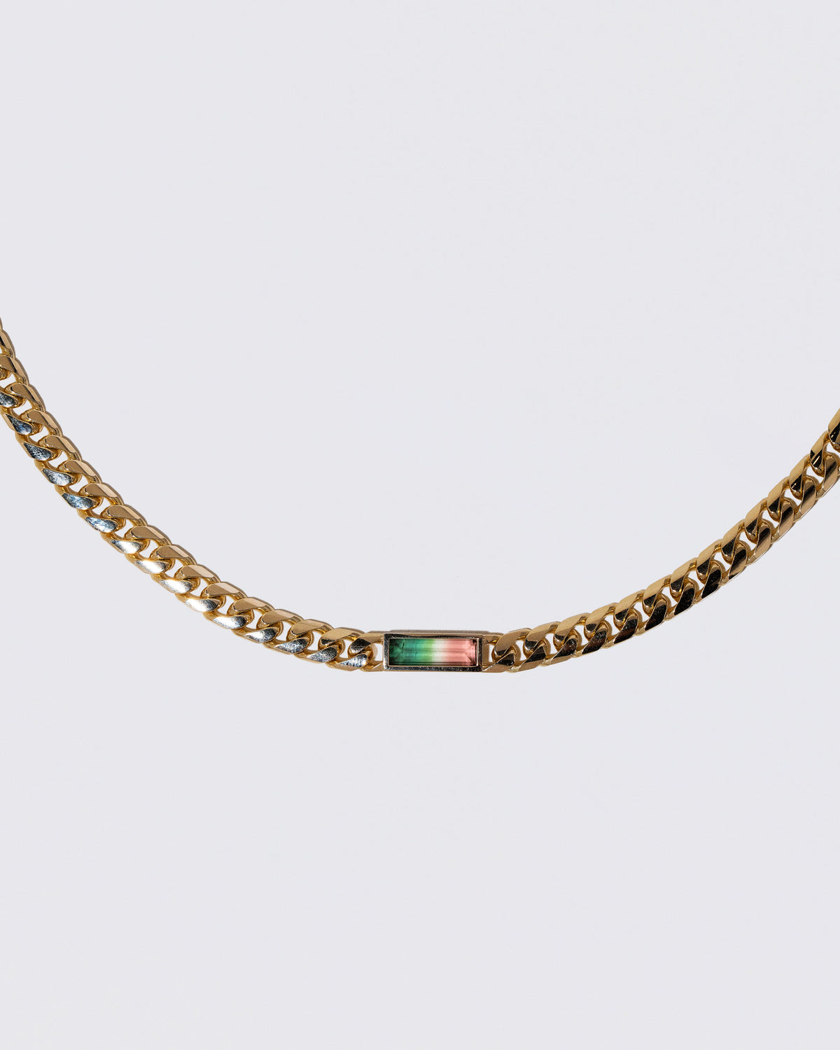 Closeup details of the Identity Chain Bicolor Tourmaline Necklace 001 on light color background.