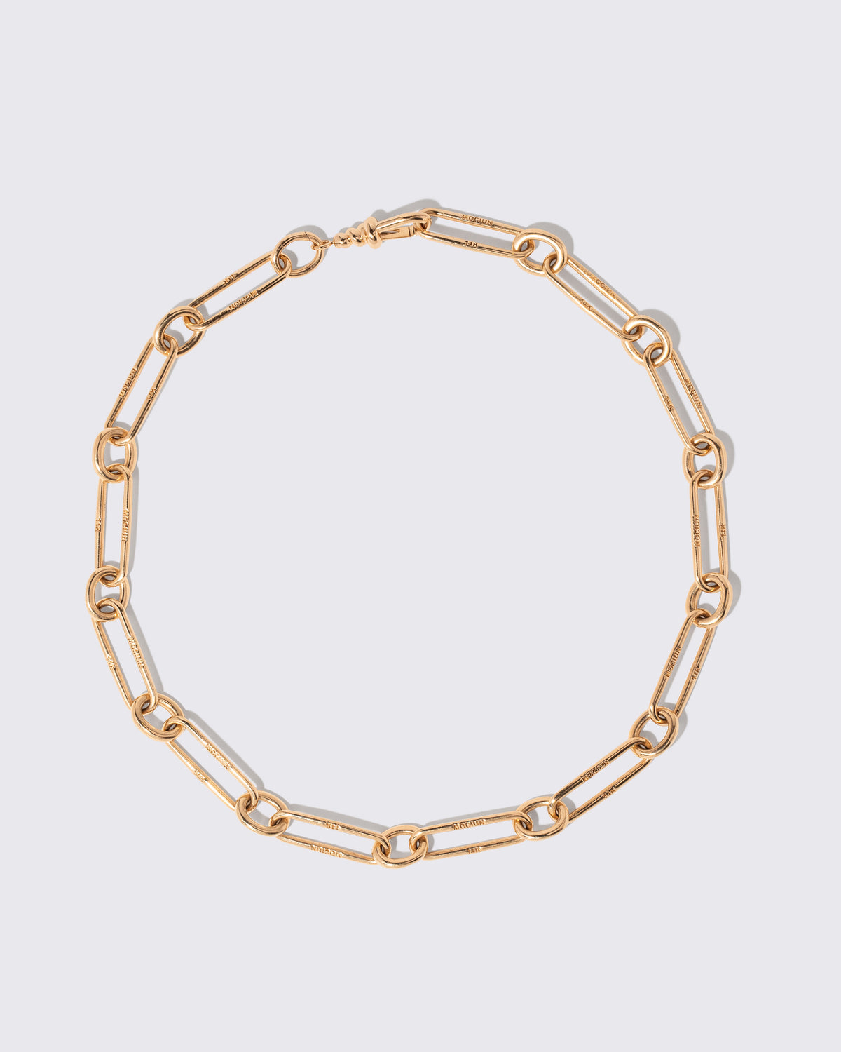 Link Necklace on light color background.
