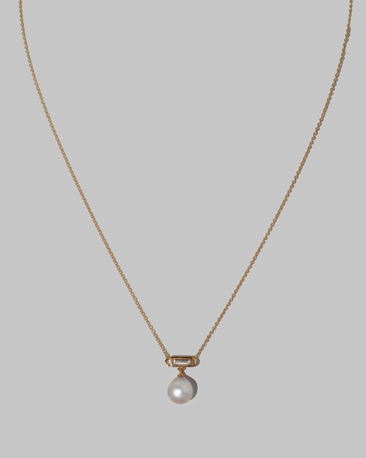 Closeup details of the Poseidon Necklace on light color background.