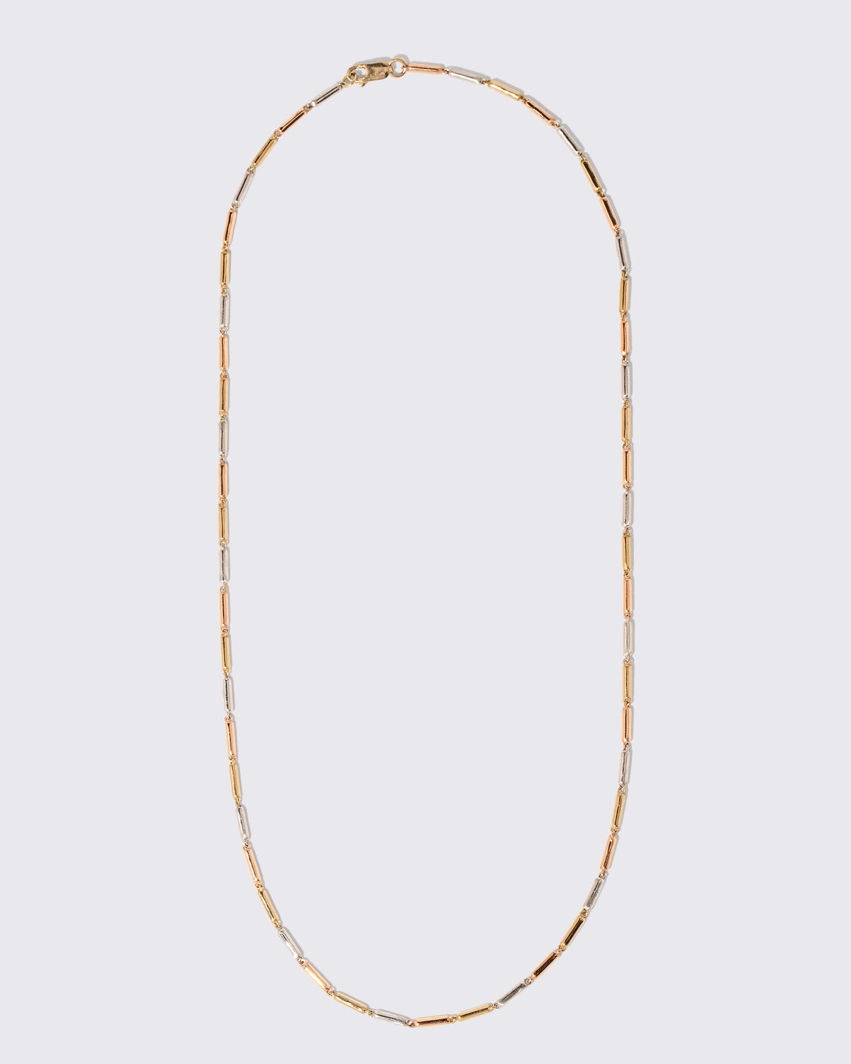 Tricolor Butter Chain Necklace on light color background.