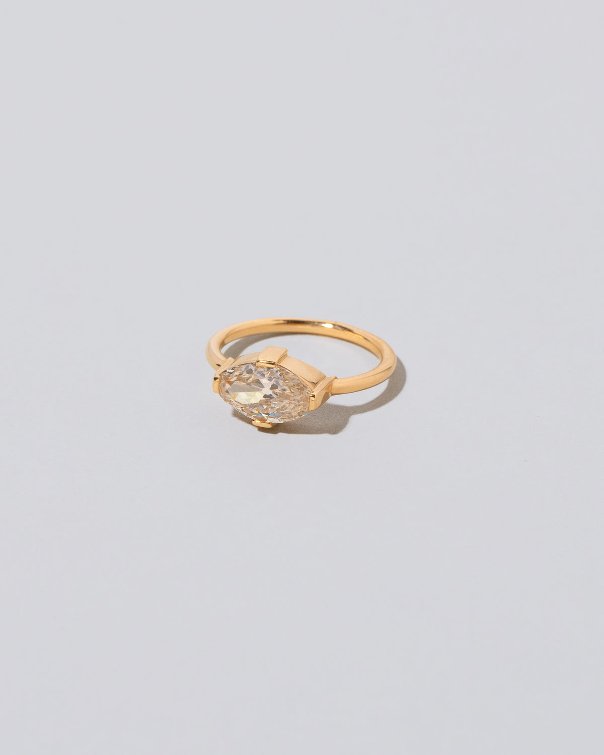 View from the side of the Eupheme Ring on light color background.