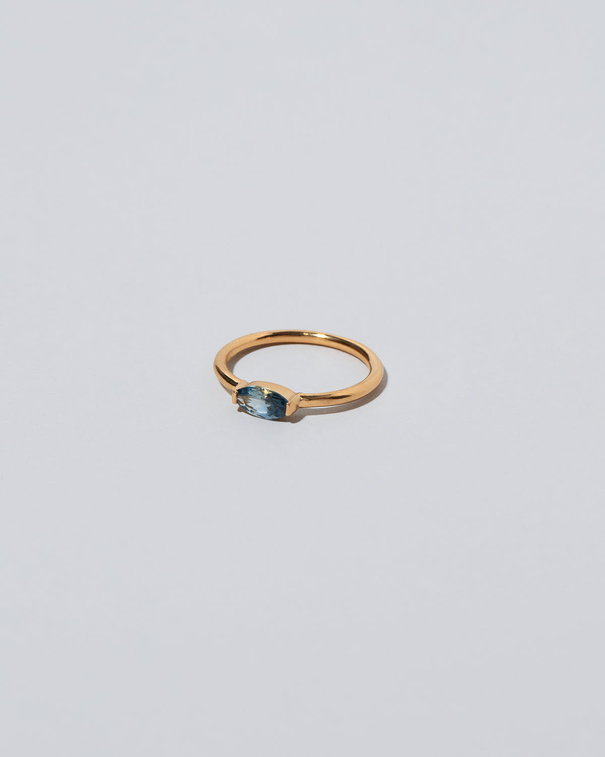 View from the side of the Blue Devant Ring on light color background.