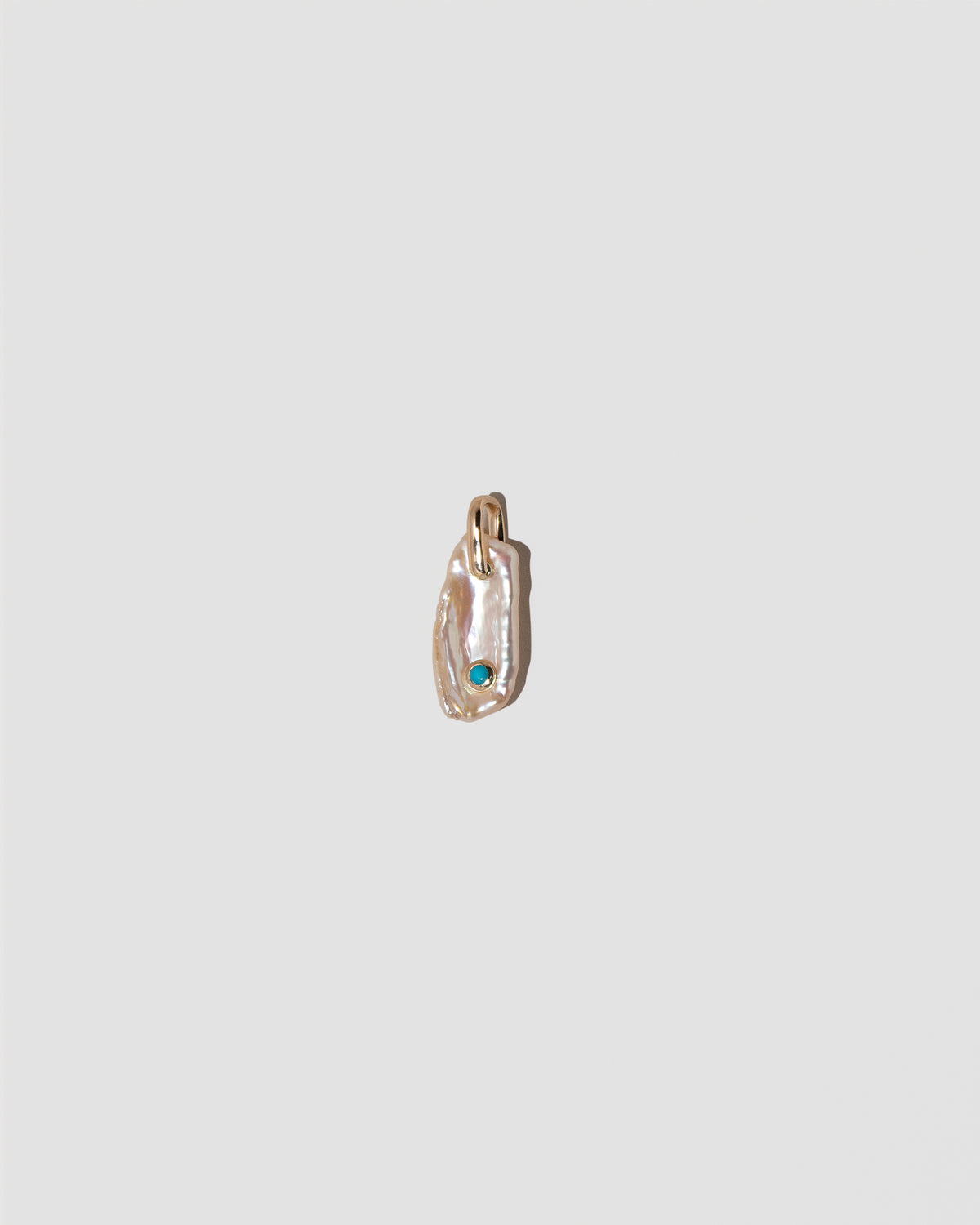 December Birthstone Pearl Pendant With Turquoise on light color background.