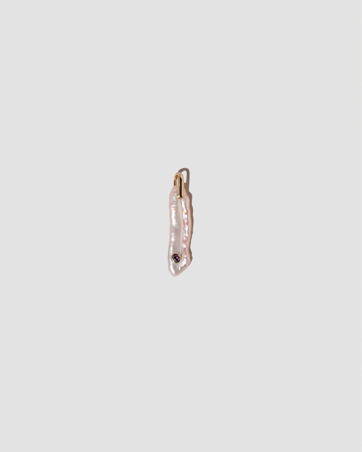 February Birthstone Pearl Pendant With Amethyst on light color background.