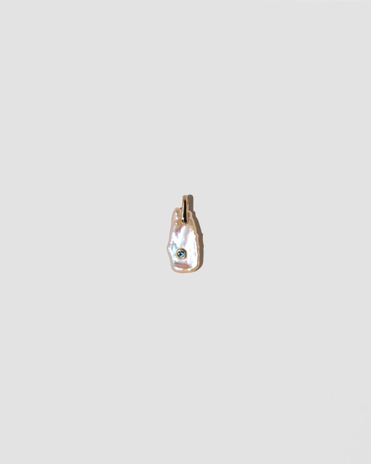 March Birthstone Pearl Pendant With Aquamarine on light color background.