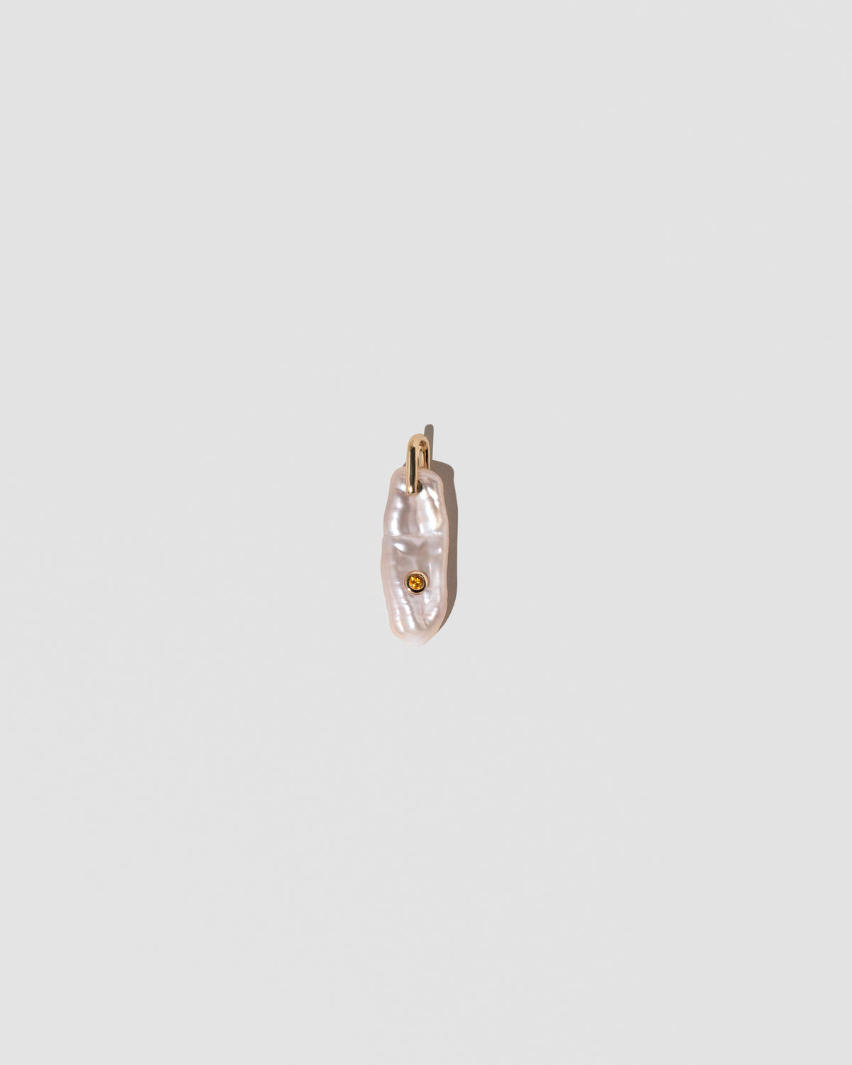 November Birthstone Pearl Pendant With Citrine on light color background.