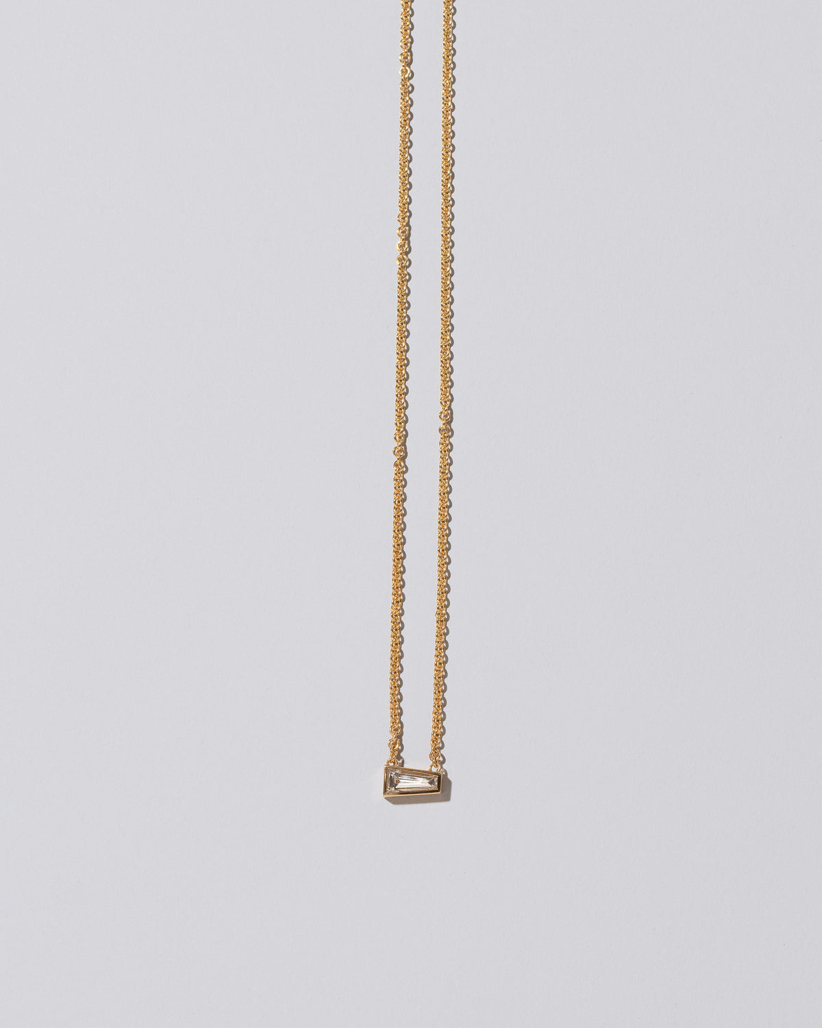 Purity Necklace on light color background.