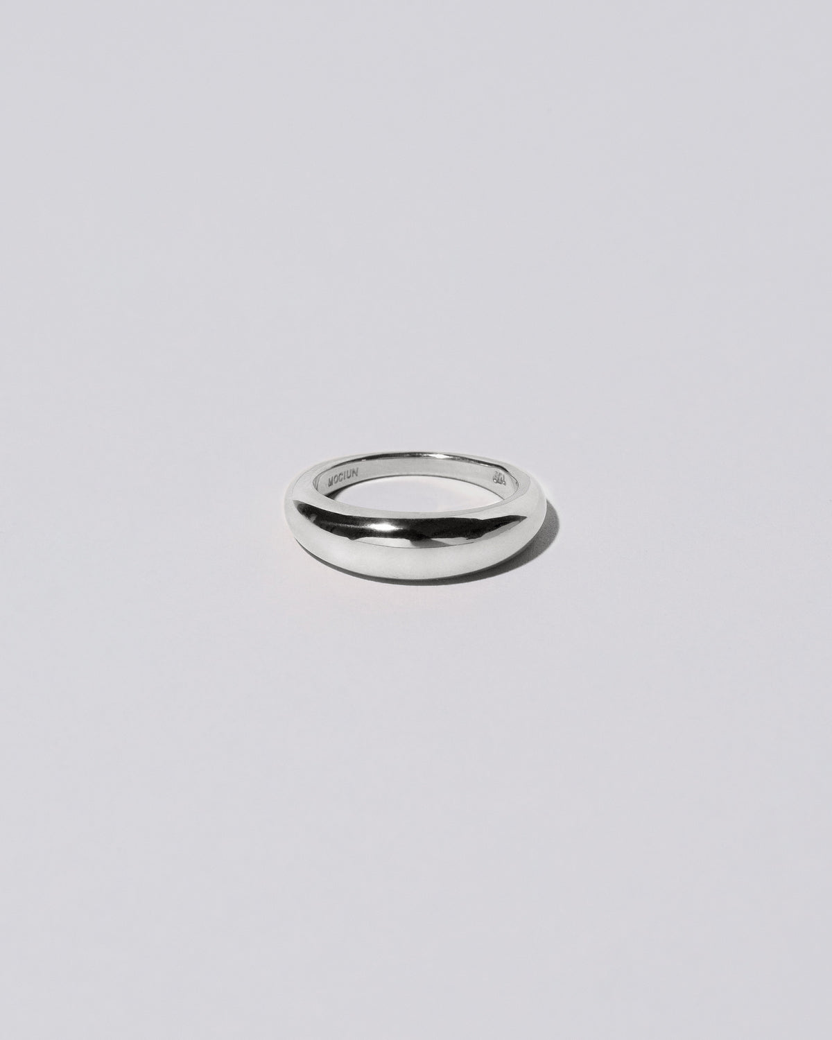 Platinum 5.5mm Venus Band on light color background.