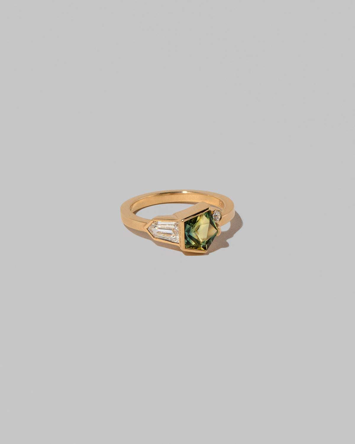 View from the side of the Ammi Ring on light color background.
