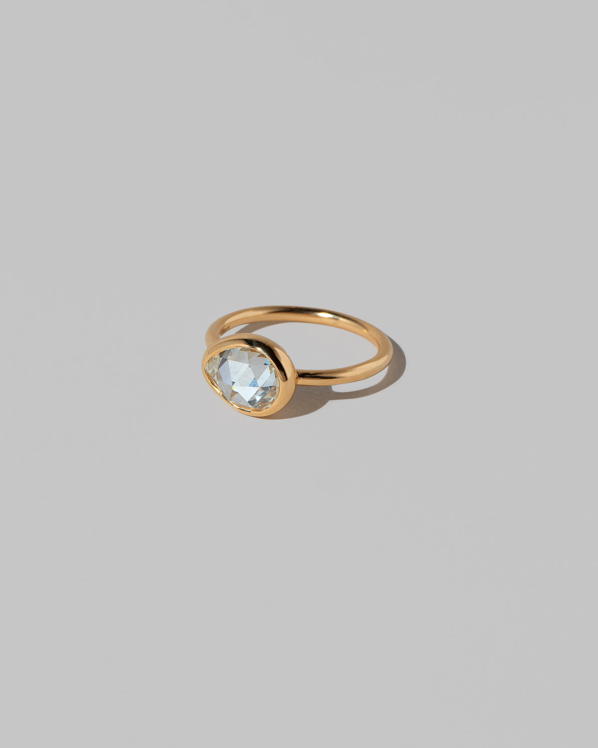 View from the side of the Gusher Diamond Ring 027 on light color background.