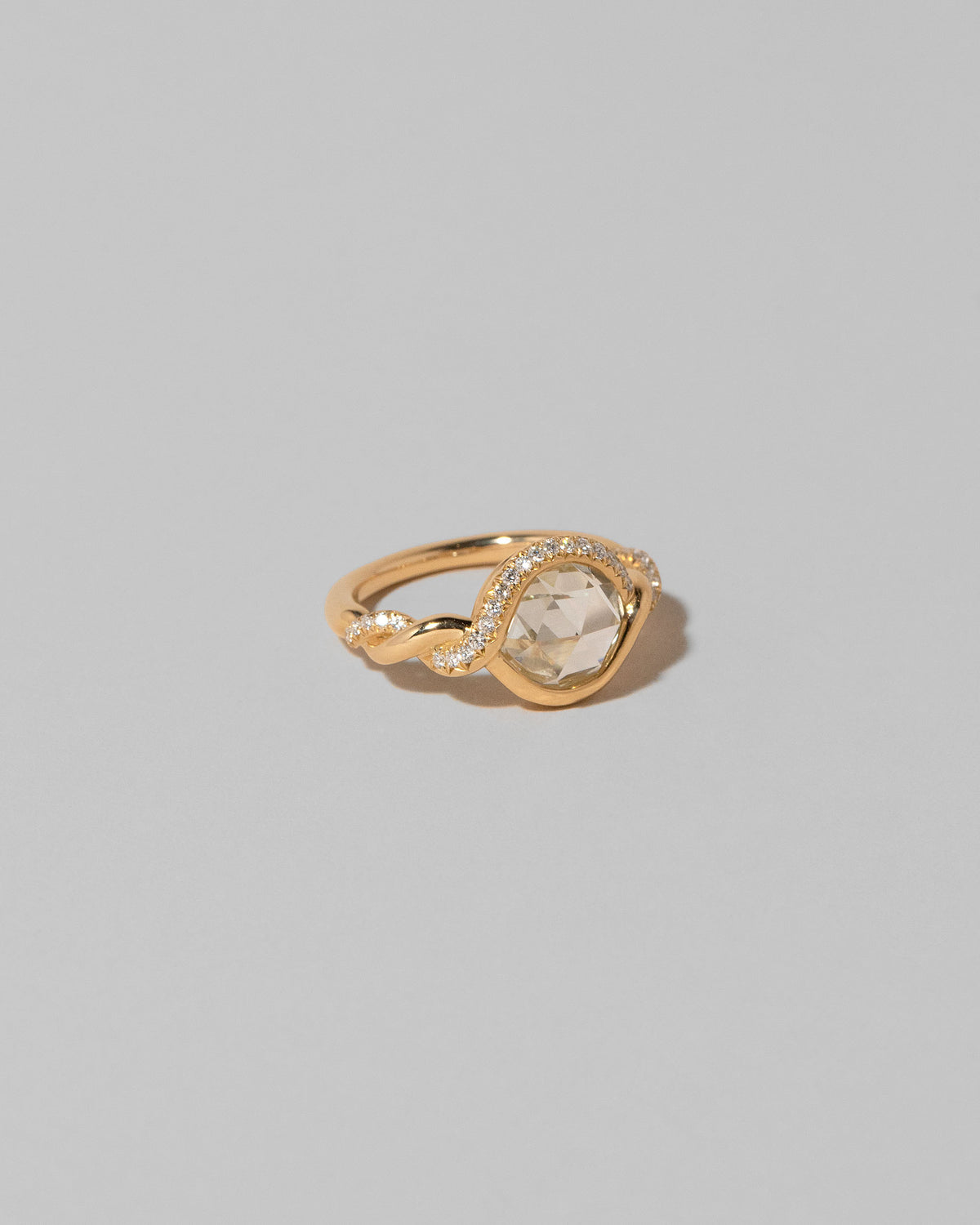 View from the side of the Entwine Ring on light color background.