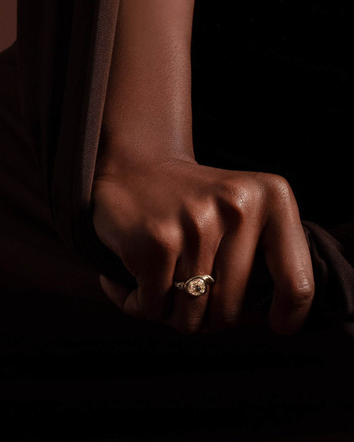 Styled image featuring the Coil Ring on model.