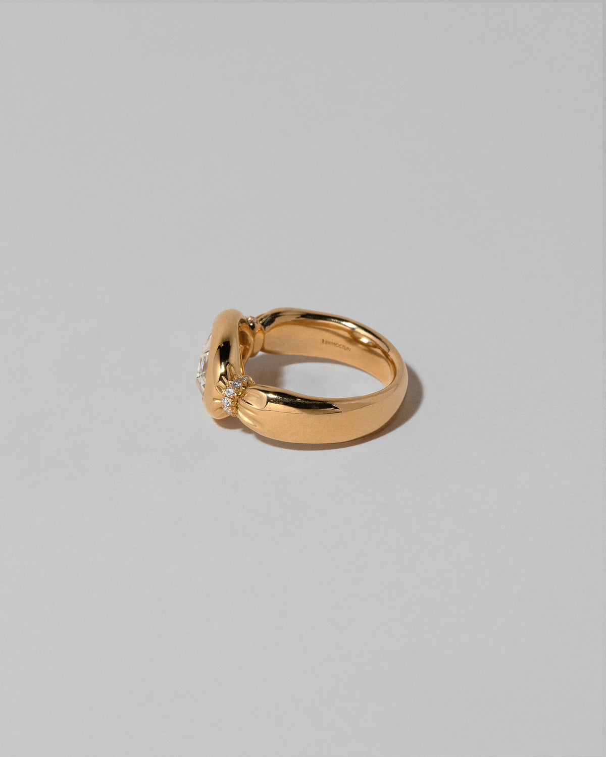 View from the back of the Contort Ring on light color background.