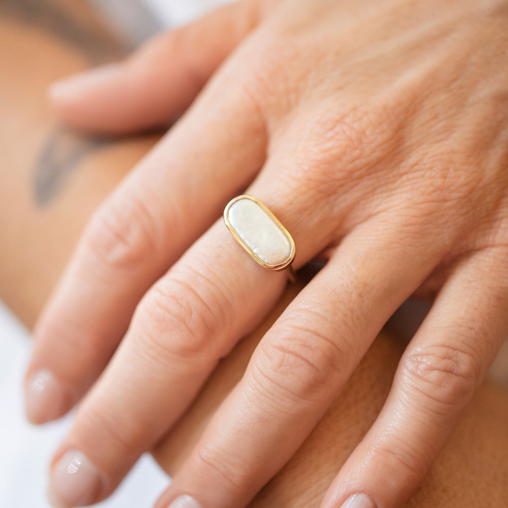 product_details::Gold Anhinga Pearl Ring on model.