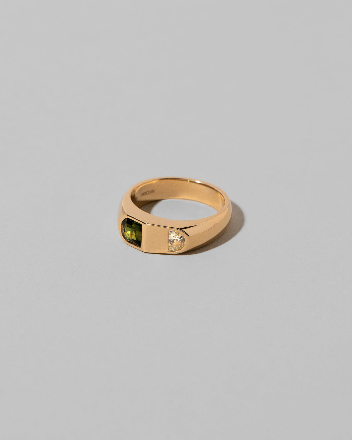 View from the side of the Archway Ring on light color background.