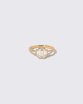 Diamond Assertion Ring on light color background.